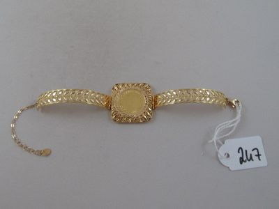 an image of a gold watch with a chain around it