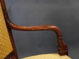 an antique wooden chair with yellow upholstered upholstered upholstered upholstered upholstered upholstered upholstered upholstered uphol