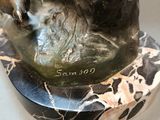 statue of a man on a horse on a marble base