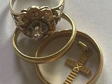 two gold rings that are sitting on top of each other