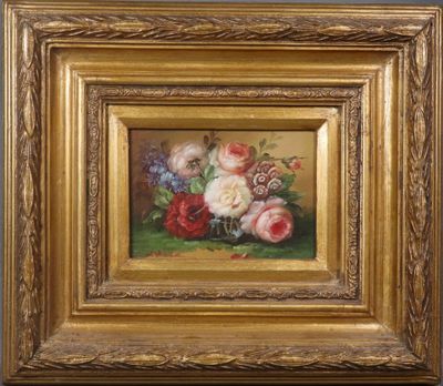 a painting of flowers in a gold frame on a green surface