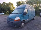 a blue van that is parked in a parking lot