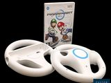 volant Nintendo Wii avec le jeu Mario Kart devant