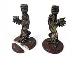 two figurines that are sitting on top of each other