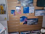 a room with a lot of boxes and papers on the wall