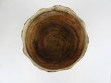 a brown bowl sitting on top of a white table