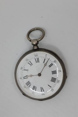 a silver pocket watch with roman numerals on the face