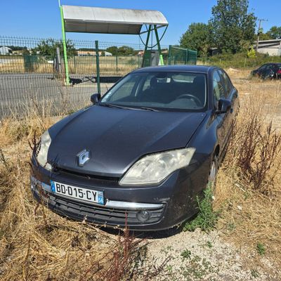 a black car that is parked in the grass