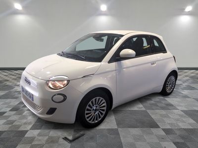 a picture of a white smart car in a showroom
