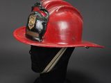 fireman ' s helmet on a mannequin head on a black background