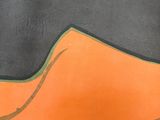 painting of a black and orange shoe on a black surface