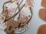 a pair of sandals and a pair of flip flops on a table