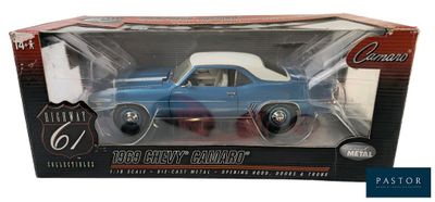blue and white toy car in a box on a white background