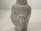 a small statue of a person sitting on a table