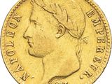 a close up of a gold coin on a white background