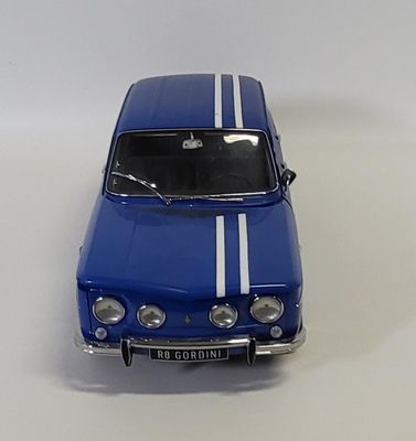 a blue toy car with a white stripe on the front
