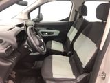 the interior of a small car with two seats and a steering wheel
