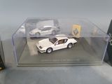 a white car and a white car in a display case