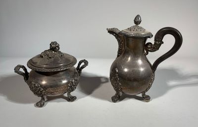 pair of antique silverplated teapots and saucers