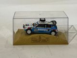 a small toy car in a clear display case