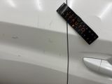 a close up of a car door handle with a sticker attached to it