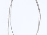 two silver necklaces on a white background with a white background