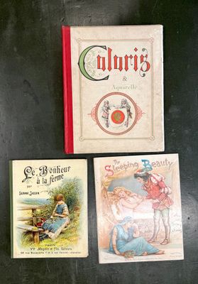 three children ' s books sitting on a black table
