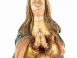 a statue of a woman holding a baby in her hands