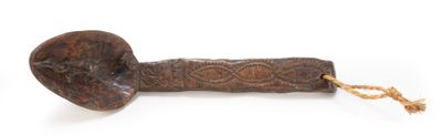 an old wooden pipe with a rope around it on a white surface