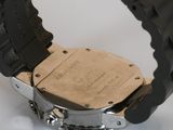 a close up of a watch on a white surface