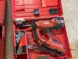 a red tool box with tools in it on the floor