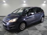 a picture of a small blue car parked in a garage
