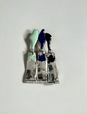 a picture of a silver and blue object on a white surface