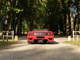 a red sports car parked on the side of the road