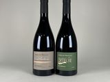 two bottles of wine sitting next to each other on a table