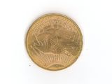 a gold coin on a white surface with a white background