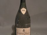 a bottle of wine that is sitting on a table