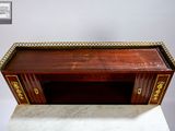 a wooden desk with a marble top and gold trimming