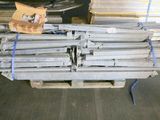 several pieces of wood are stacked on a pallet in a warehouse