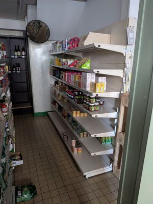 many shelves in the store that have food on them