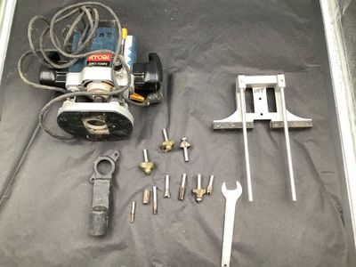 tools laid out on a table with a black background