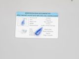 a picture of an identification document with a blue pin