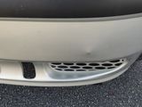 a close up of a car ' s front bumper