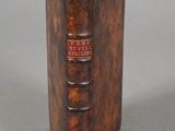 an old book that is sitting on a table