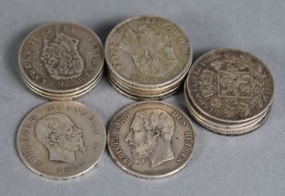 six british coins sitting on top of each other on a table