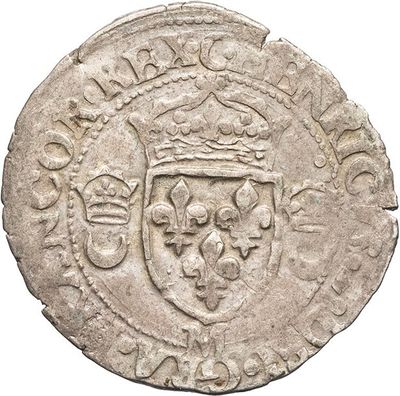 a close up of a coin with a crown on it