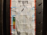 a close up of a tire with a sticker on it