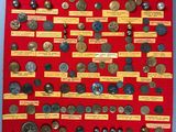 a red display case with a bunch of coins on it