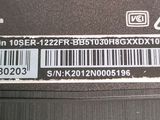 a close up of the back of a laptop with a barcode on it