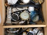 a wooden box filled with lots of watches and watches